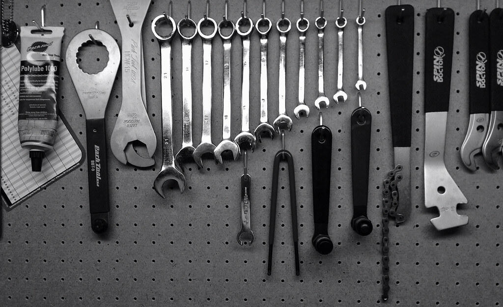 bike tools on a pegboard